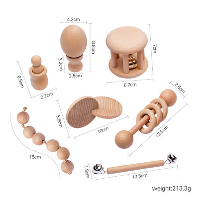 O gráfico chocalha 7Pc Teether de madeira para o anel saindo os dentes de madeira do bebê